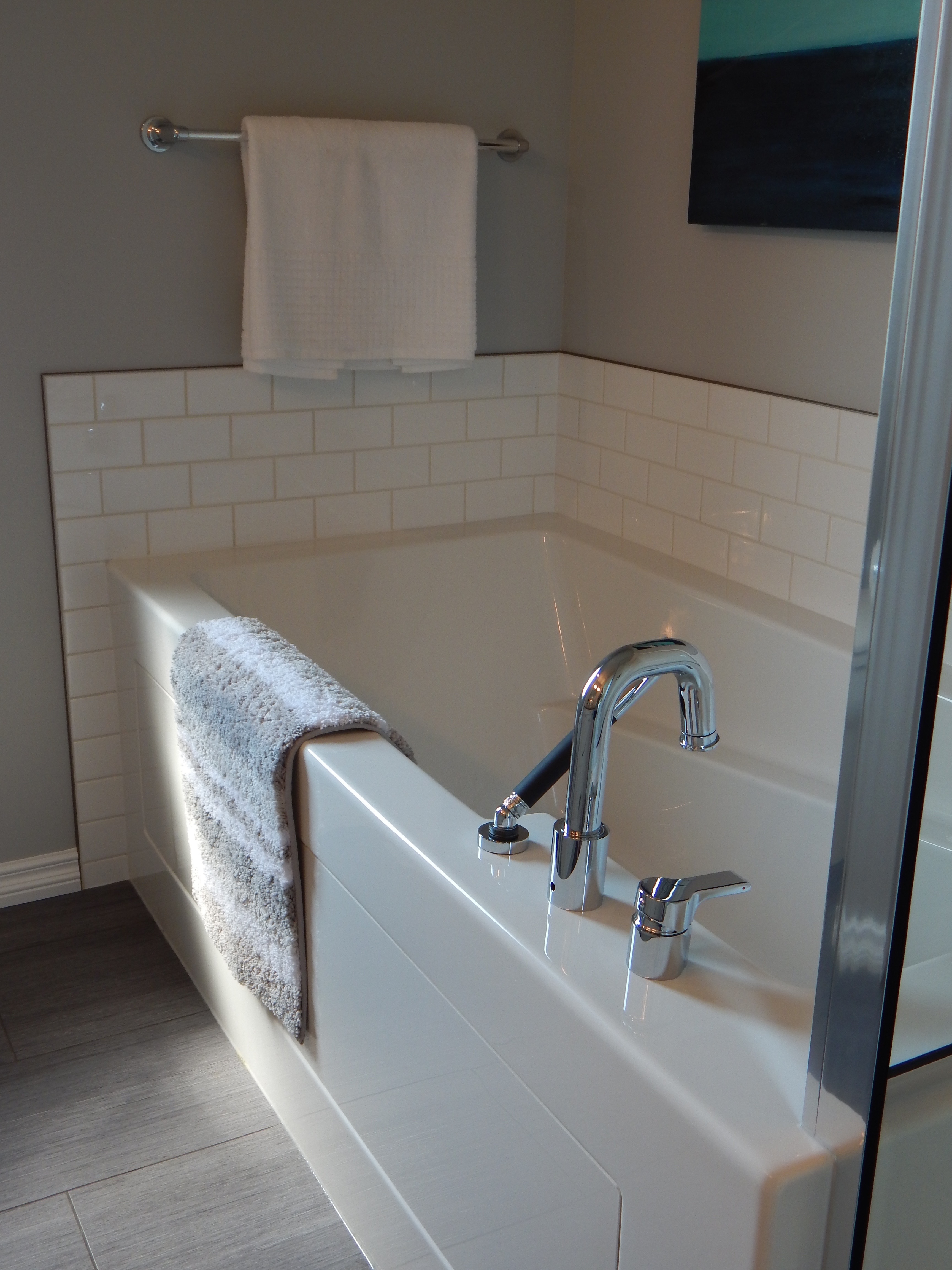 A bath with a mixer tap and shower head
